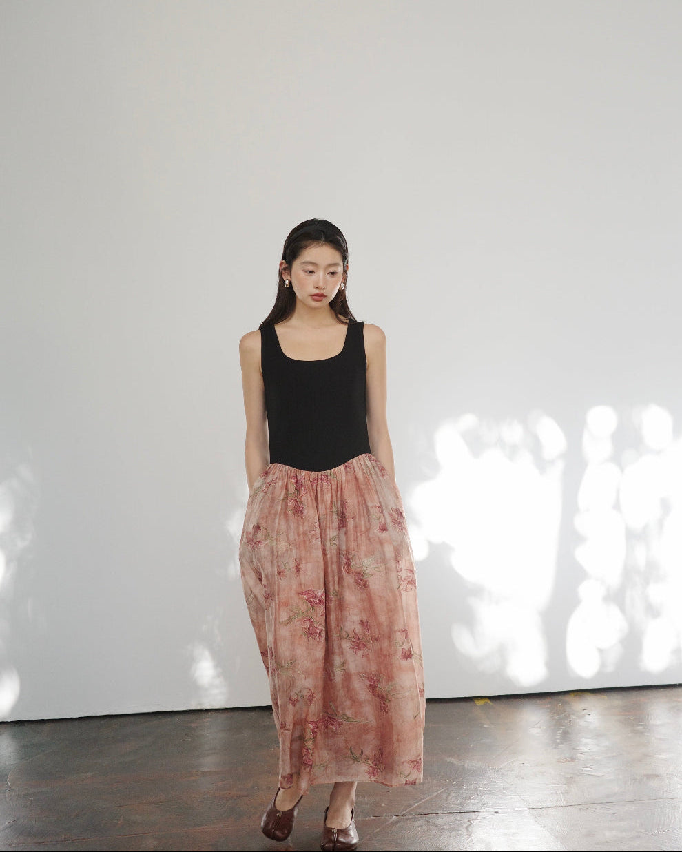 Elegant high-waisted, sophisticated asymmetrical sleeveless dress with a unique, refined aesthetic—new arrival