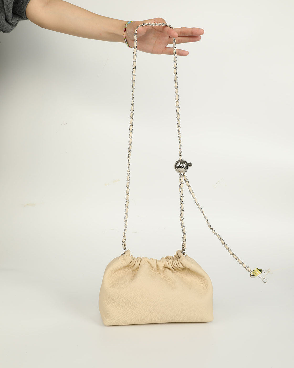 Crossbody chain bag with cloud-shaped design